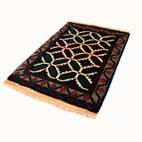 Narli hand-knotted vintage mini wool rug (1'9” x 2'5")