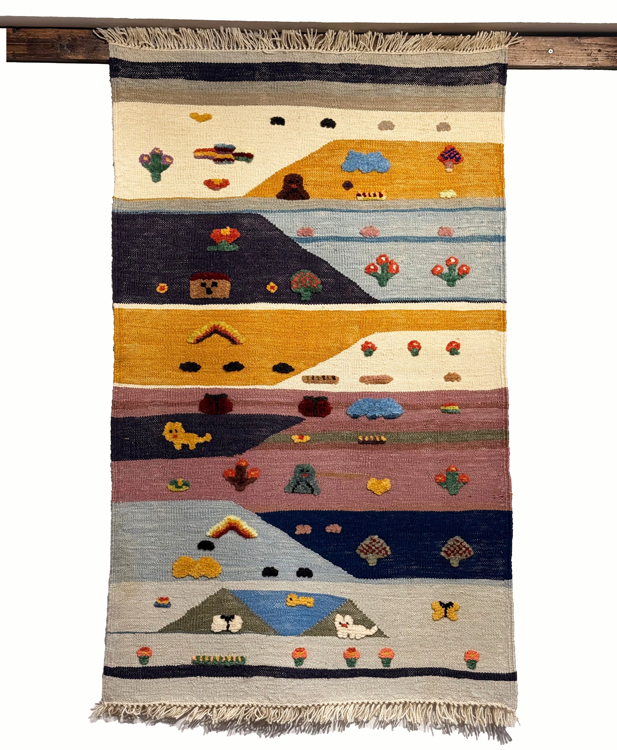Patchwork Valley kids rug made from natural wool, perfect for nursery, playroom, and children's room decor.
